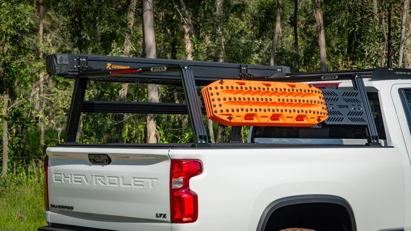 A T-Rax tub rack loaded with recovery boards on a Chevrolet 2500
